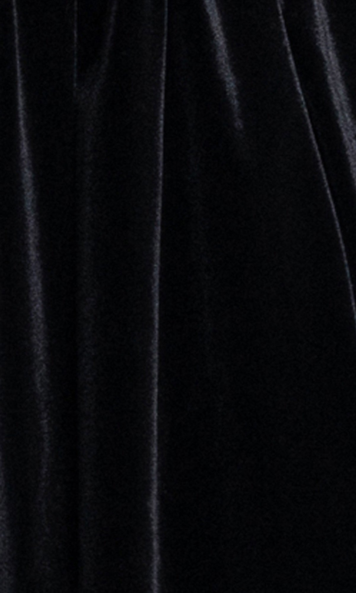 Close-up of black velvet fabric with a soft, shiny texture and vertical folds—ideal for the Strapless Black Hoco Dress: Blondie Nites 6417BN, a chic short party dress in junior sizes.
